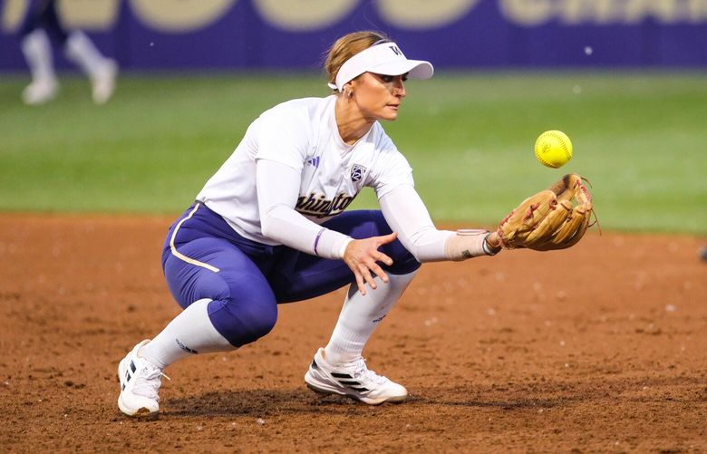 Washington’s Baylee Klingler knocks down the line drive off Northern Colorado’s Alison Steinker that falls back into her glove, and starts the double-play that gets the Huskies out of the top of the second inning with two runners on. 223875