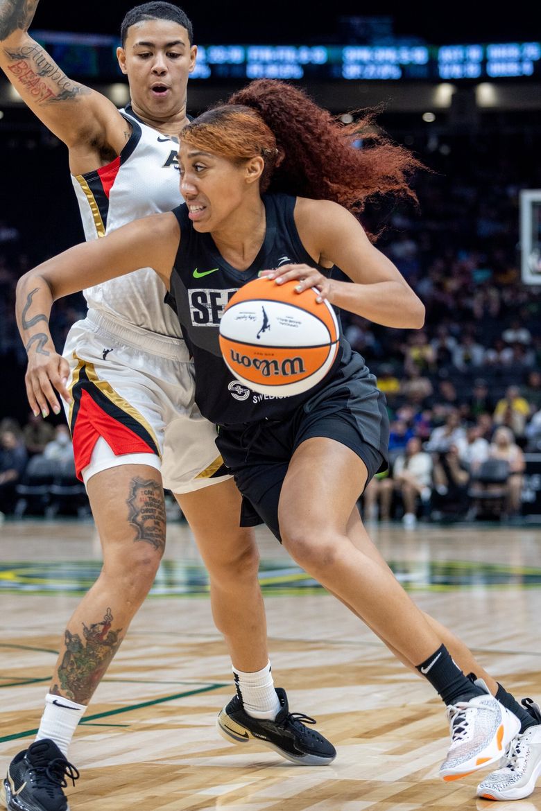 Seattle Storm guard Sue Bird drives the ball down court against