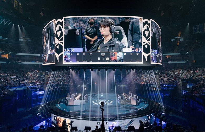 FILE — Spectators watch the game play of teams on stage on huge overhead screens during the League of Legends World Championship competition at the Chase Center in San Francisco, Nov. 5, 2022. At least two organizations in America’s most prominent league for professional video game players are selling their teams, underscoring the industry’s uncertain future.
(Jason Henry/The New York Times) XNYT XNYT