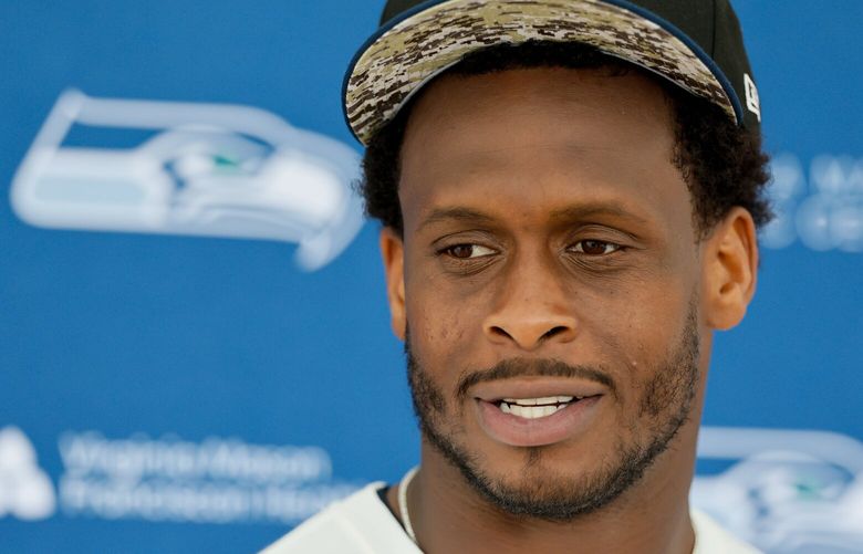 Seattle Seahawks quarterback Geno Smith talks with the media after the first OTA. 223885