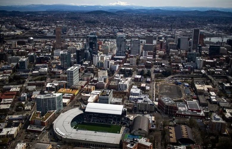 Providence Park can be seen in the foreground of an aerial view of downtown Portland in March. (Dave Killen / oregonlive.com via TNS)