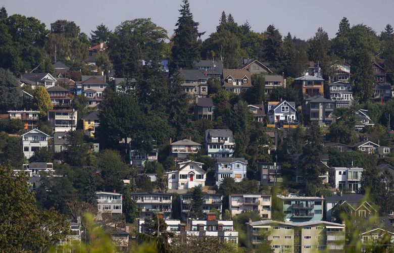Queen Anne homes are seen from Magnolia, Wednesday, Sept. 21, 2022 in Seattle. Seattle is the fastest cooling market in the nation according to new numbers from Redfin.