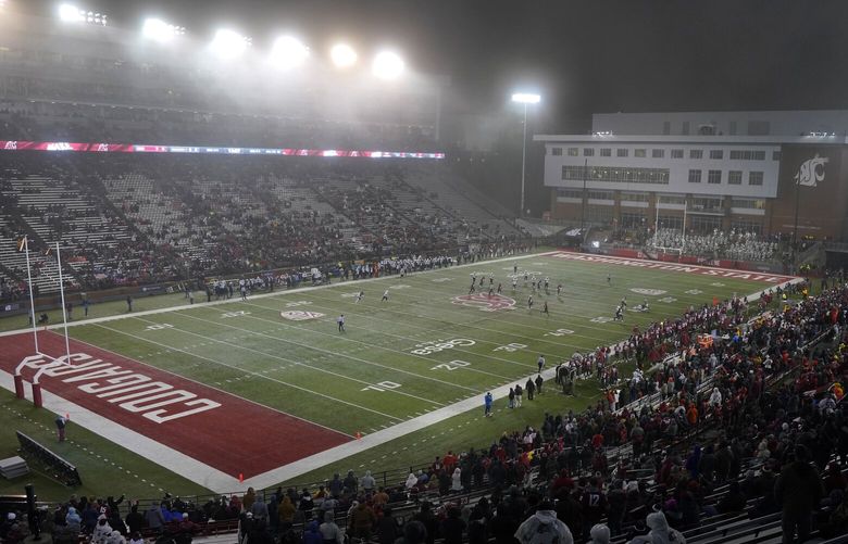 Light snow falls at Martin Stadium during the first half of an NCAA college football game between Washington State and Arizona, Friday, Nov. 19, 2021, in Pullman, Wash. (AP Photo/Ted S. Warren)
