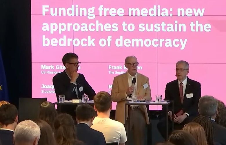 The Seattle Times Publisher Frank Blethen, center, addresses a May 4 event in Brussels. At right is U.S. Ambassador to the European Union Mark Gitenstein and to the left is news media consultant Joaquin Alvarado. (Screenshot of Friends of Europe YouTube stream)