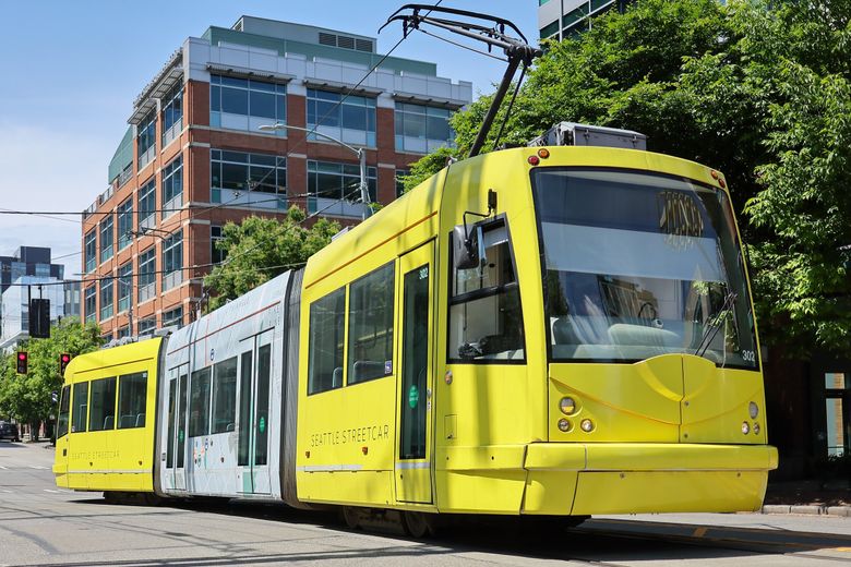 A Seattle streetcar makes its route through the South Lake Union neighborhood of Seattle. (Kevin Clark / The Seattle Times)