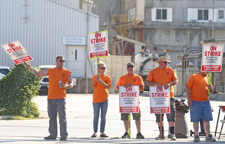 On Wednesday, August 16, 2017, King County concrete truck drivers, members of Teamsters Union 174, picket the entrance at 5975 East Marginal Way South (CQ).