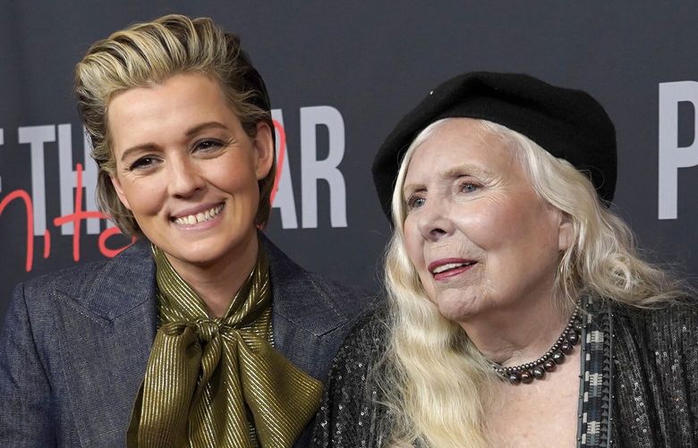 Brandi Carlile, left, and Joni Mitchell arrive at the 31st annual MusiCares Person of the Year benefit gala honoring Mitchell on Friday, April 1, 2022, at the MGM Grand Conference Center in Las Vegas. (AP Photo/Chris Pizzello)