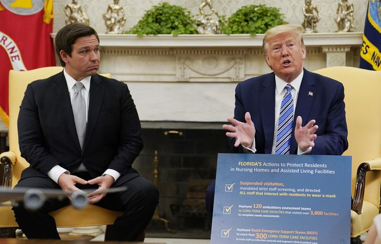 FILE – President Donald Trump speaks during a meeting with Gov. Ron DeSantis, R-Fla., in the Oval Office of the White House, April 28, 2020, in Washington. (AP Photo/Evan Vucci, File) WX205 WX205