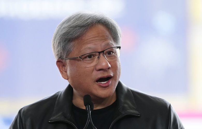 FILE – Nvidia Co-founder, President, and CEO Jensen Huang speaks at the Taiwan Semiconductor Manufacturing Company facility under construction in Phoenix, Tuesday, Dec. 6, 2022. Nvidia shares skyrocketed early Thursday after the chipmaker forecast a huge jump in revenue for the next quarter, notably pointing to chip demand for AI-related products and services.(AP Photo/Ross D. Franklin, File) 