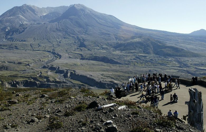 Only a gray haze remains in the air around Mount St. Helens, Wash., several hours after a small steam eruption sent steam and some ash several thousand feet in to the air Friday, Oct. 1, 2004, as seen from the Johnson Ridge Observatory. The eruption, which scientists had been predicting for several days, didn’t stop hundreds of curious visitors from visiting the site Friday. (AP Photo/Ted S. Warren)