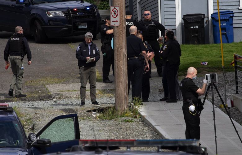 Seattle police officers gather near an alley where there was an officer-involved shooting,  near 37th Ave South and South Dakota St in the Mt. Baker neighborhood Wednesday, April 29, 2029,

The shooting occurred following a domestic violence call involving a man with a firearm in a nearby park. He assaulted a woman several times during the day and then grabbed their child.  The child is not injured.  The woman was badly assaulted.  The suspect was shot by police and is in custody.  213820