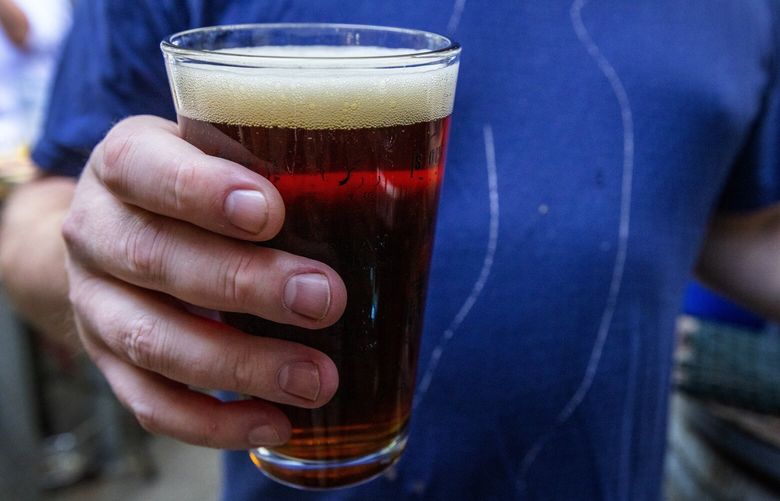 At Fiddler’s Inn the microbrews and craft beers flow, including this Planktonic Red Ale by Georgetown’s Jellyfish Brewing Company, Wednesday night, May 24, 2023 in Seattle.