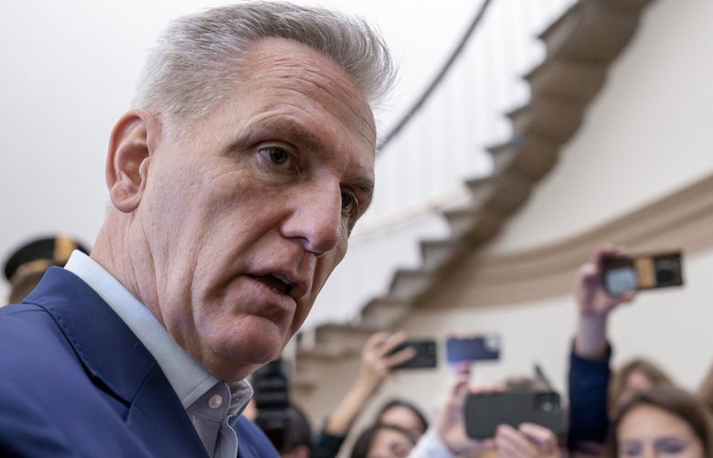 Speaker of the House Kevin McCarthy, R-Calif., talks to reporters about the debt limit negotiations as he arrives at the Capitol in Washington, Friday, May 26, 2023. McCarthy says the mediators “made progress” on a deal with the White House to raise the debt limit and cut federal spending, as they race for agreement this weekend. (AP Photo/J. Scott Applewhite) DCSA104 DCSA104