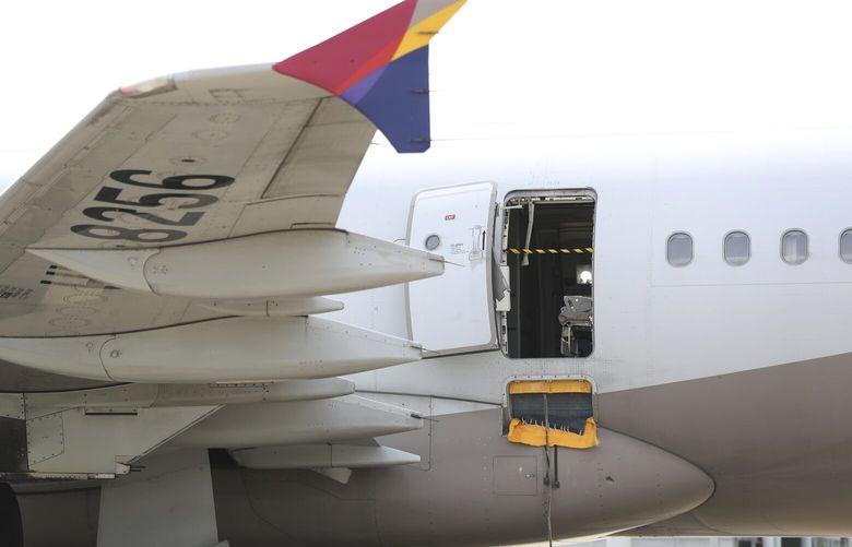 An Asiana Airlines plane is parked as one of the plane’s doors suddenly opened at Daegu International Airport in Daegu, South Korea, Friday, May 26, 2023. A passenger opened a door on an Asiana Airlines flight that later landed safely at a South Korean airport Friday, airline and government officials said. (Yun Kwan-shick/Yonhap via AP) SEL802 SEL802