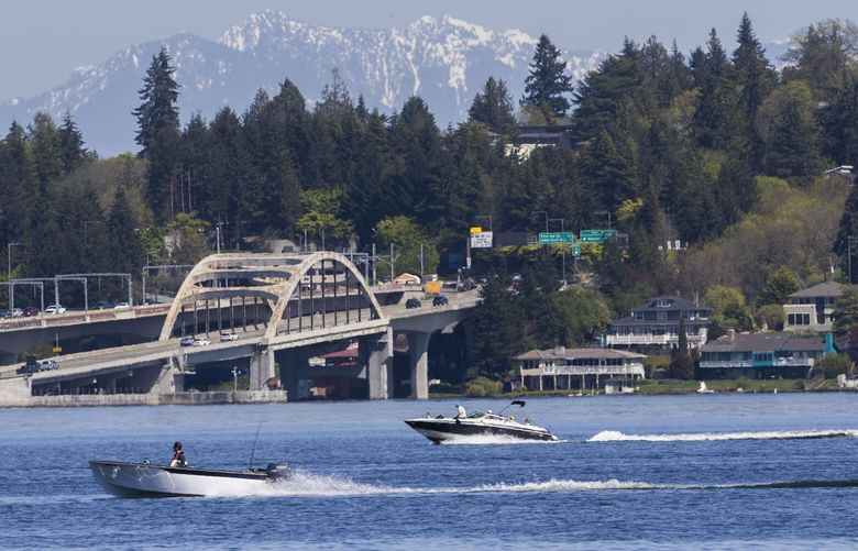 Boats ride along the waters of Lake Washington on Friday, April 28, 2023.