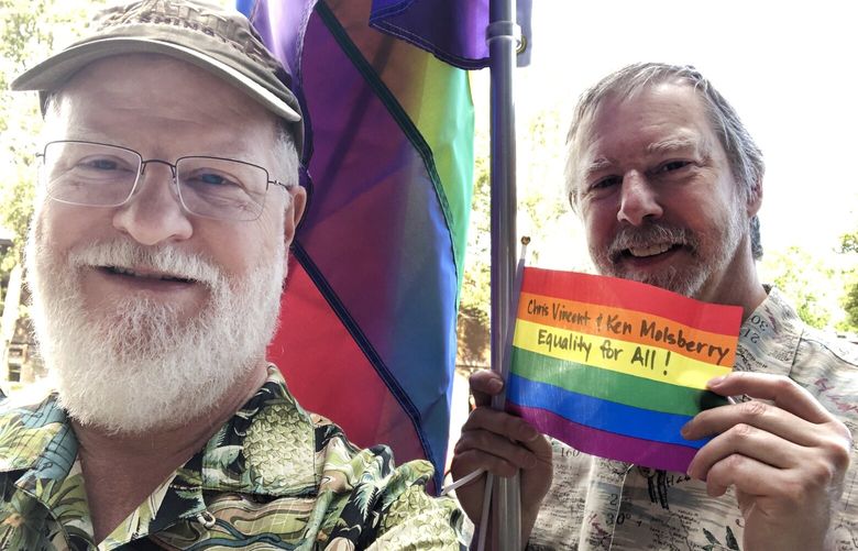 Chris Vincent (left) and his husband Ken Molsberry (right) at an annual West Seattle Junction Pride event.