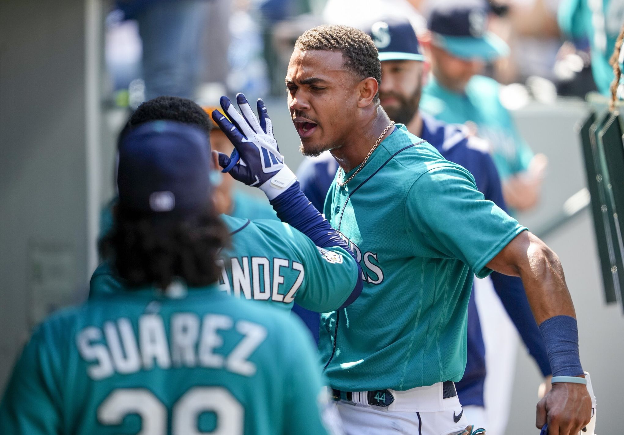 Julio Rodriguez of the Seattle Mariners reacts after hitting a