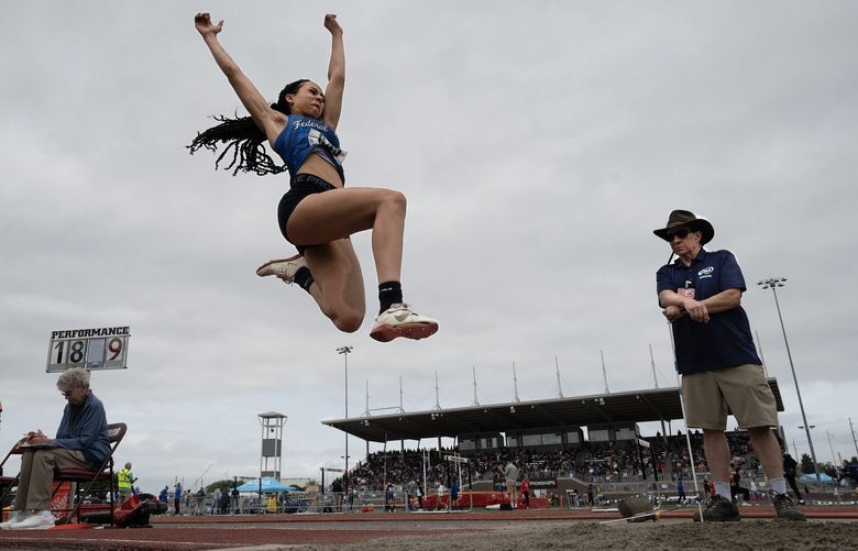 Federal Way’s Cassandra Atkins sets sail en route to a state title in the 4A girls long jump competition during the final day of the WIAA state track and field championships at Mount Tahoma High School in Tacoma, Washington, on Friday, May 26, 2023.