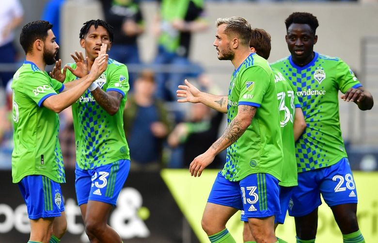 Jordan Morris is congratulated for his goal in the 22nd minute as the Seattle Sounders FC play the New York Red Bulls at Lumen Field Saturday May 27, 2023.