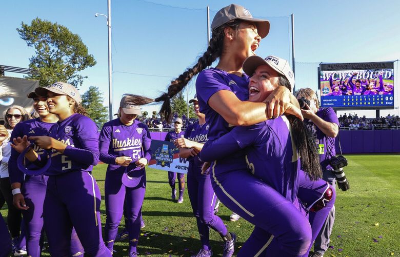Madison Huskey leaps into the arms of Sami Reynolds as the Huskies celebrate their 2-0 win over Louisiana to advance to the College World Series. 224031 224031
