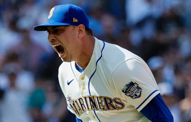 Seattle Mariners relief pitcher Tayler Saucedo yells after getting out of a bases loaded jam during the tenth inning. 224045