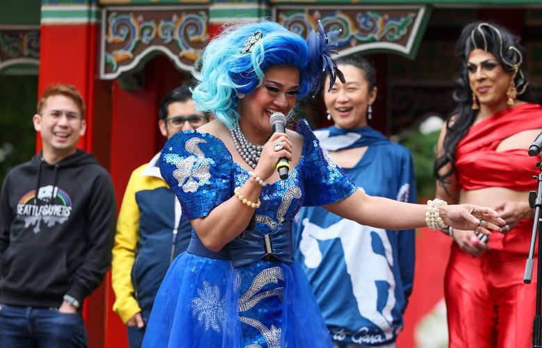 Aleksa Manila, founder of Pride ASIA, shares a laugh in makes introductions during the 11th annual Pride ASIA festival Sunday afternoon at Hing Hay Park in Seattle, Washington on May 28, 2023.