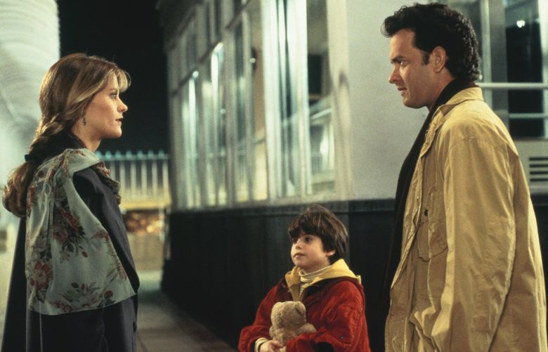 Meg Ryan, Ross Malinger and Tom Hanks in a scene from “Sleepless in Seattle.”