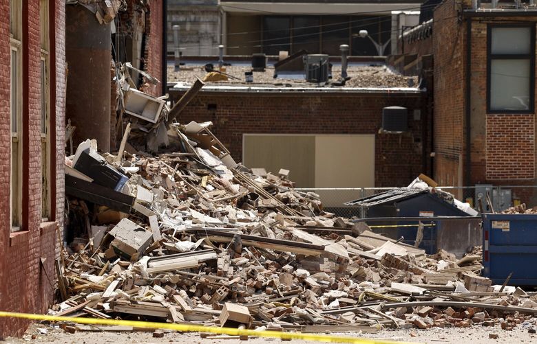 Rubble lies in a pile outside The Davenport on Main Street in Davenport, Iowa, on Monday, May 29, 2023. A section of the six-story downtown apartment building collapsed Sunday. (Nikos Frazier/Quad City Times via AP) IADAV102 IADAV102