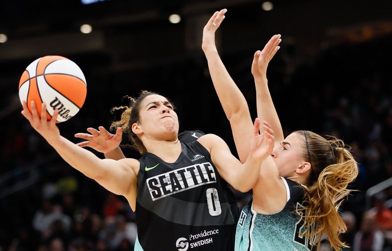 Seattle Storm guard Kia Nurse tries to go through New York Liberty guard Sabrina Ionescu for a shot during the second quarter. 224046