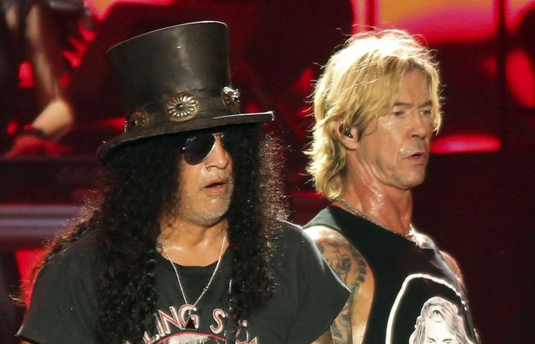 Guns N’ Roses’ Slash, left, and Duff McKagan perform on the first weekend of the Austin City Limits Music Festival at Zilker Park on Friday, Oct. 4, 2019, in Austin, Texas. (Photo by Jack Plunkett/Invision/AP)