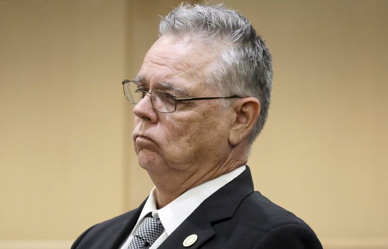Former Marjory Stoneman Douglas High School School Resource Officer Scot Peterson stands during a hearing at the Broward County Courthouse in Fort Lauderdale, Fla., on Tuesday, May 30, 2023. Peterson is about to be tried on charges he failed to confront the gunman who murdered 14 students and three staff members at a Parkland high school five years ago. (Amy Beth Bennett/South Florida Sun-Sentinel via AP, Pool) FLLAU102 FLLAU102