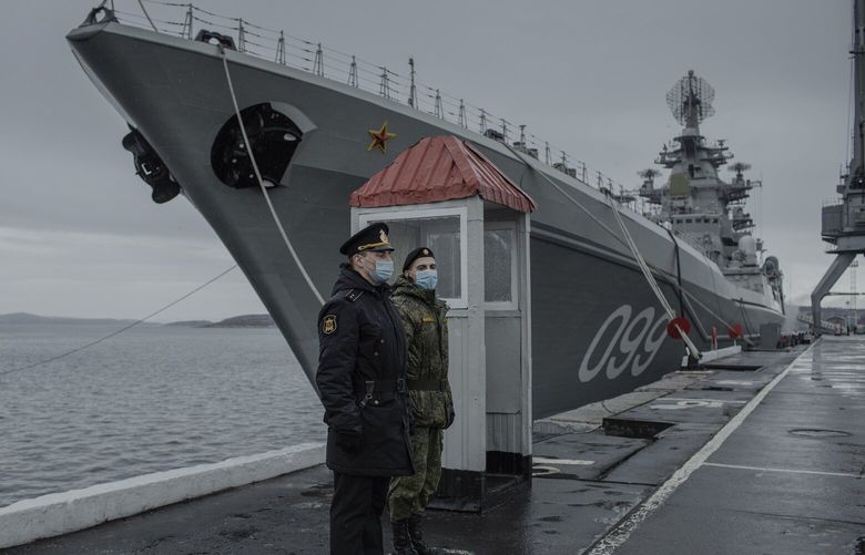 FILE – Russian military personnel stand by the battle cruiser Peter the Great, at its Arctic base of Severomorsk, Russia, on May 13, 2021. Russia, China and the West are all seeking to expand their military presence in the Arctic. (Emile Ducke/The New York Times) XNYT0404 XNYT0404