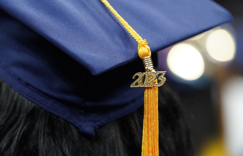 A tassel with 2023 on it rests on a graduation cap as students walk in a procession for Howard University’s commencement in Washington, Saturday, May 13, 2023. (AP Photo/Alex Brandon) DCAB550 DCAB550