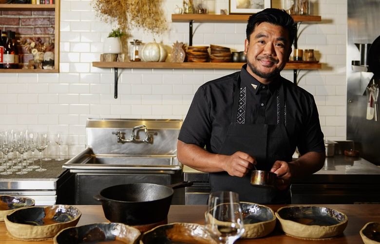 Chef Aaron Verzosa poses for a portrait while demonstrating plating Tailor Made, a course in which diners disclose their hunger level from five to one, at Filipino American restaurant Archipelago, Wednesday, May 24, 2023, in Seattle. Verzosa is nominated for a 2023 James Beard Award in the Best Chef: Northwest and Pacific category. (AP Photo/Lindsey Wasson)