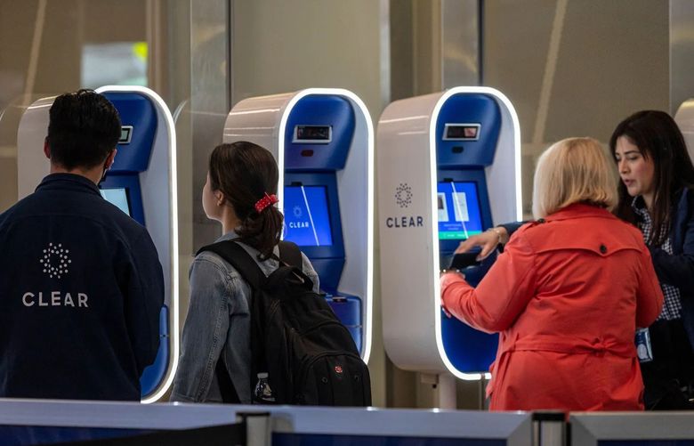 Travelers use Clear Plus kiosks at San Francisco International Airport on Thursday. (Photographer: David Paul Morris/Bloomberg)