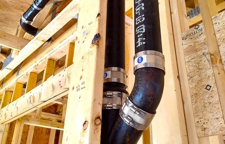 This cast iron stack connects to standard PVC or ABS plastic pipe with ease. (Tim Carter/Tribune Content Agency)