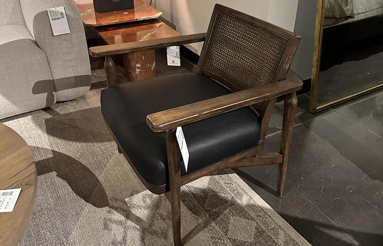 A modern take on a midcentury modern-style chair is displayed on a retail floor. (TNS)