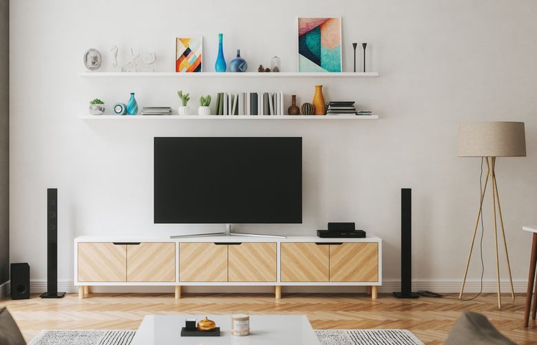 Using vertical space with shelving helps give the illusion of a larger room. (Getty Images)