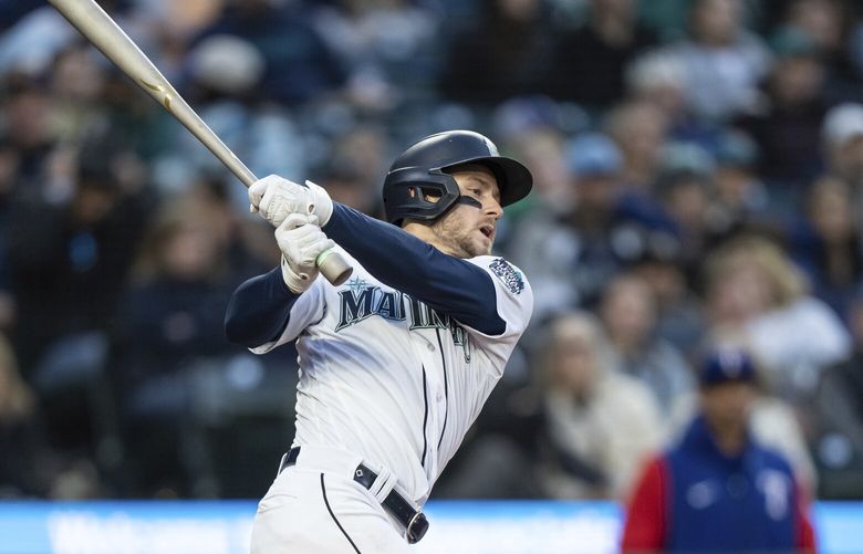Seattle Mariners’ Jarred Kelenic takes a swing during an at-bat in a baseball game against the Texas Rangers, Tuesday, May 9, 2023, in Seattle. The Mariners won 5-0. (AP Photo/Stephen Brashear) OTK23 OTK23