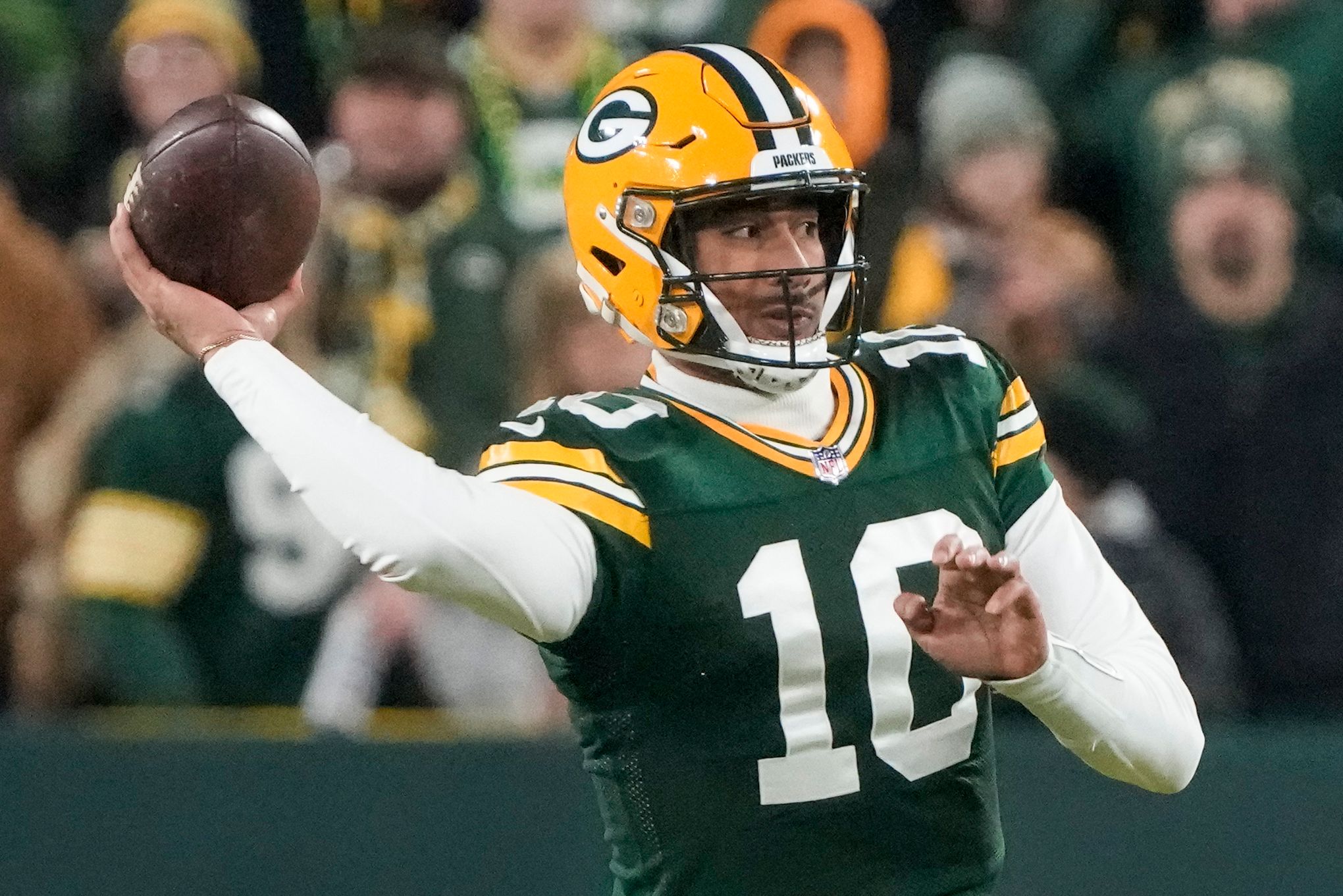 Green Bay Packers quarterback Jordan Love (10) drops back to pass