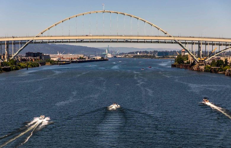 Motor boats sail near the Fremont Bridge on the Willamette River during a heatwave in Portland, Oregon, U.S., on Saturday, June 26, 2021. Record heat is set to bear down on the Pacific Northwest, threatening fresh strains on regional power and water supplies and dragging down air quality through next week. 775673166