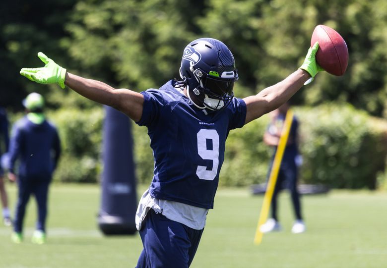 Seattle Seahawks running back Kenneth Walker III (9) looks on