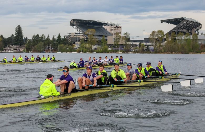 The UW mens rowing teams in the shadow of Husky Stadium Wednesday morning on the waters of Union Bay at the University of Washington, Seattle, Washington in on April 26, 2023.