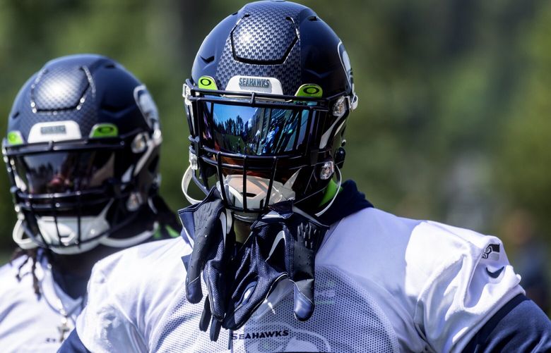 Seahawks defensive end Dre’Mont Jones, right, during an OTA, Thursday, June 1, 2023 in Renton.