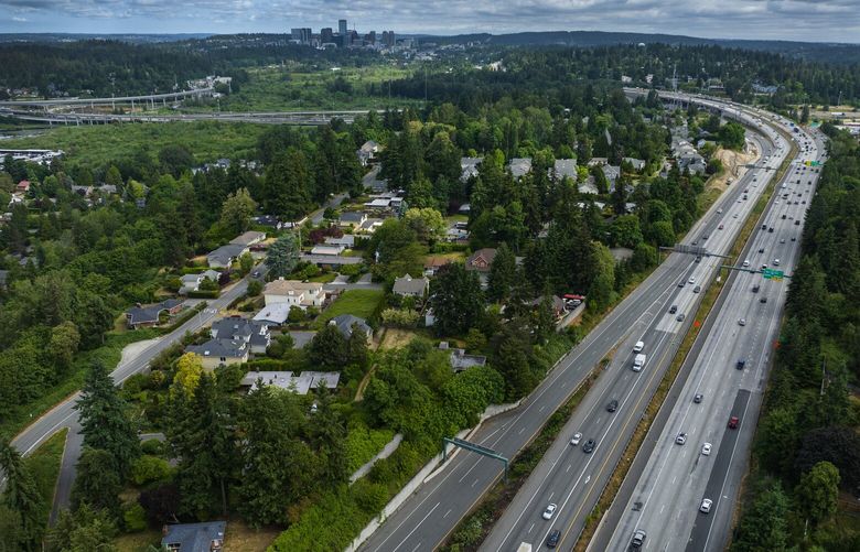 An aerial view looking north from Coal Creek Parkway, with downtown Bellevue in the background, shows Interstate 405, Thursday, June 1, 2023. According to WSDOT’s website an anticipated closure starts “10 p.m. Friday , June 2 to 5 a.m. Monday, June 5: Two lanes of northbound I-405 will be closed between Coal Creek Parkway and Northeast Sixth Street.” Northbound lanes are seen on the right.