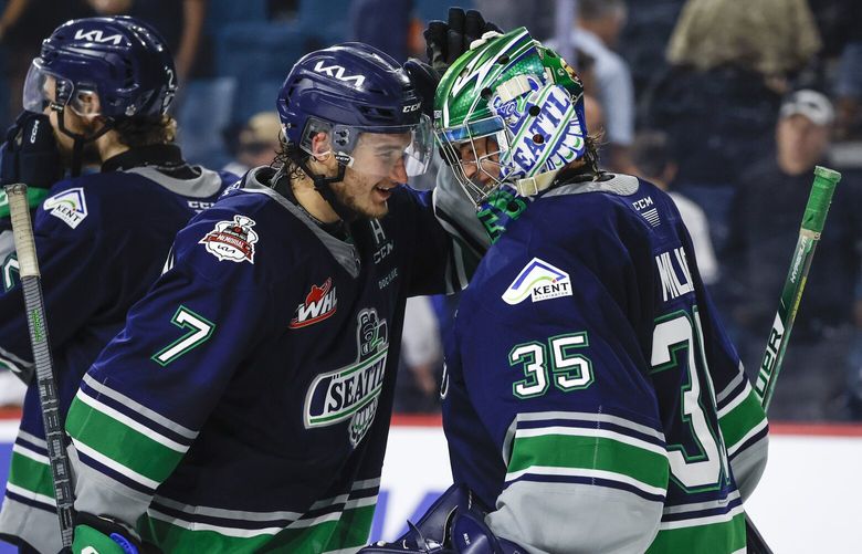 Seattle Thunderbirds forward Jordan Gustafson, left, and goalie Thomas Milic celebrate the team’s win over the Kamloops Blazers in a CHL Memorial Cup hockey game Wednesday, May 31, 2023, in Kamloops, British Columbia. (Jeff McIntosh/The Canadian Press via AP)