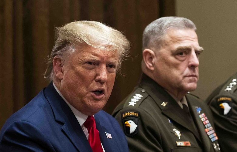 FILE — President Donald Trump, seated next to Gen. Mark A. Milley, the chairman of the Joint Chiefs of Staff, makes remarks during a briefing with senior military leaders in the Cabinet Room of the White House in Washington, Oct. 7, 2019. Prosecutors issued a subpoena for a description of military options for Iran mentioned by the former president during an interview. But Trump’s legal team said they could find no such document. (Doug Mills/The New York Times) XNYT0139 XNYT0139