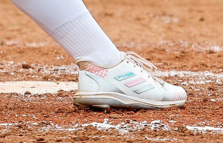 Sami Reynolds wears cleats designed by kids at Children’s Hospital for Saturday’s game. 224084