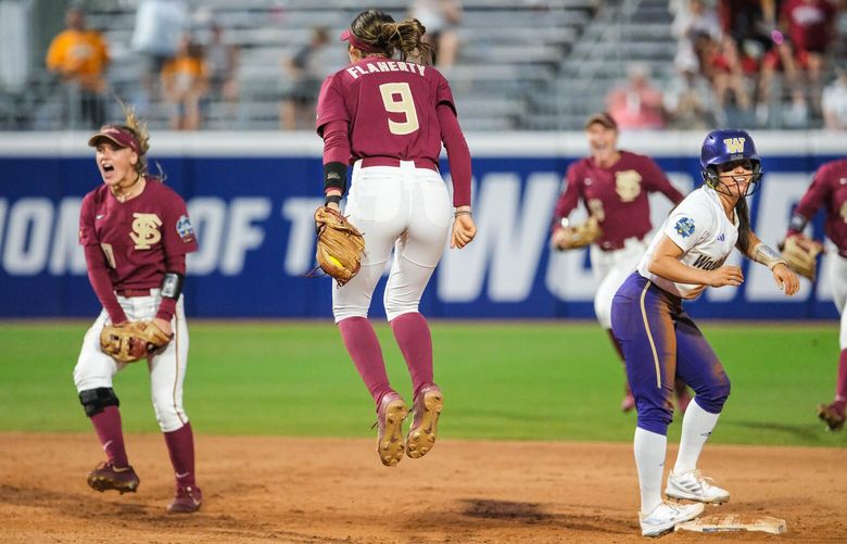 Florida State celebrates getting Megan Vandergrift in the double play ot end the game. 224084
