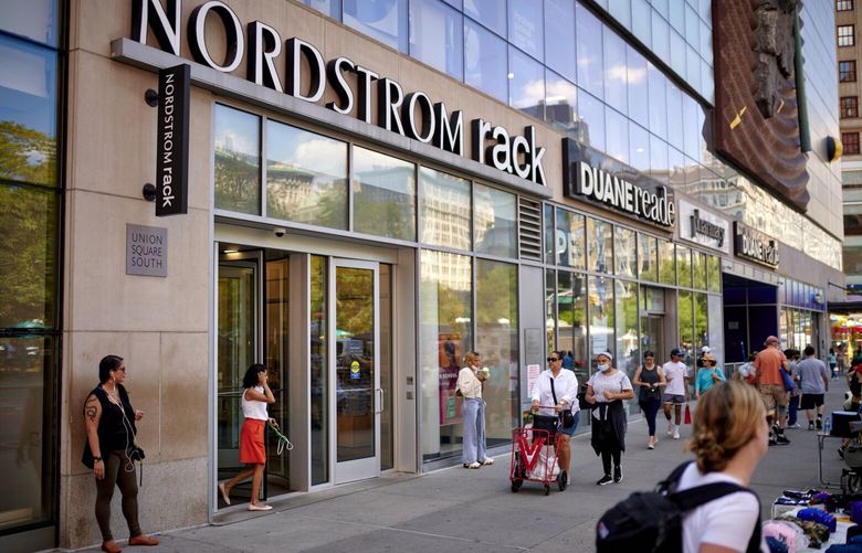 Signage outside a Nordstrom Rack retail store in New York, US, on Thursday, Aug. 25, 2022. Nordstrom Inc. tumbled 20% Wednesday in its biggest drop since November after slashing its full-year outlook, citing slowing customer traffic and demand at its off-price Rack stores. Photographer: Gabby Jones/Bloomberg